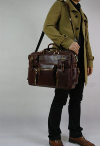Brown briefcase used for business casual purposes - the long strap is suitable for business men who will be using the briefcase in or out of the office