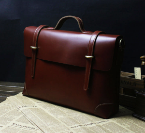 Brown Leather Satchel Briefcase - used for travel and convenience in business, and working. Can be worn with professional and unprofessional clothing.
